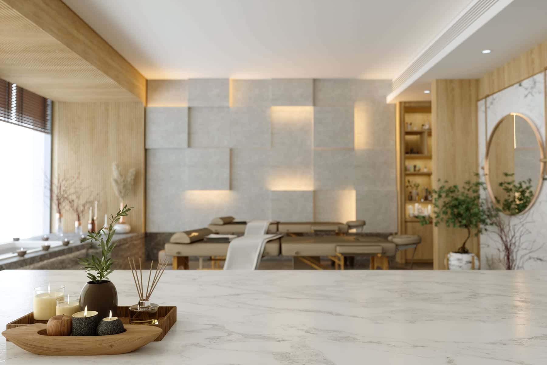 Warm boutique spa interior with candles, greenery, and massage tables at Bossa.