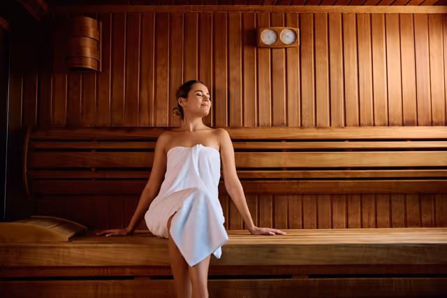 Warm wood interior of the infrared sauna at Bossa.